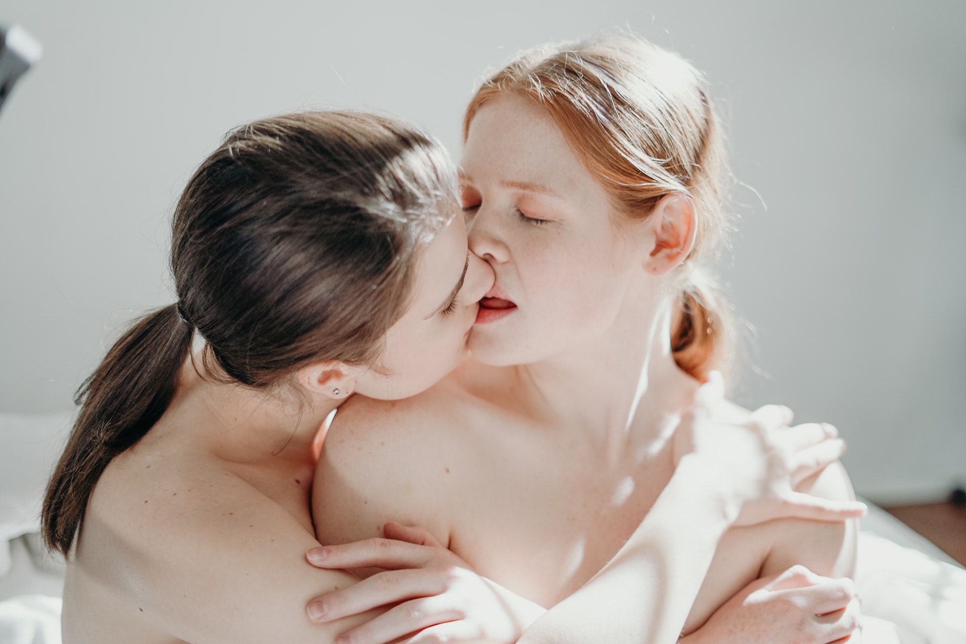 photo of women kissing
